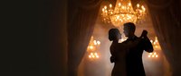 Elegant couple silhouette dancing in luxurious ballroom with golden chandelier creating romantic atmosphere for wedding celebration or formal event.