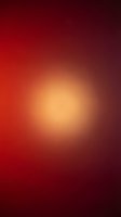 Radiant warm gradient background transitioning from deep burgundy and crimson edges to golden amber center, creating soft glowing light effect for design projects.