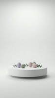 Pastel Easter eggs in soft purple pink and green colors arranged on white round platform with eucalyptus leaves against neutral beige background.