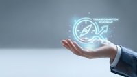 Business hand presenting glowing compass with transformation roadmap text, digital innovation concept for strategic planning and corporate guidance.