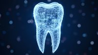 Digital tooth hologram with glowing blue wireframe structure on dark background with bokeh lights for dental technology and healthcare concepts.