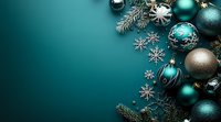 Festive arrangement of turquoise and silver Christmas ornaments, snowflakes and pine branches on dark teal background with copy space for holiday designs.