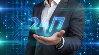Professional businessman in dark suit holding glowing 24/7 text over palm against futuristic digital circuit board background for customer service concepts.