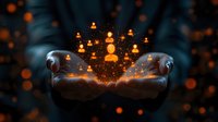 Magical glowing orange figures floating above cupped hands with sparkles and bokeh effects against dark background, spiritual energy concept for meditation and mindfulness.