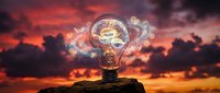 Glowing light bulb with brain circuit pattern on rock against dramatic sunset sky, representing innovation, creativity, and intelligent solutions for business and technology concepts.
