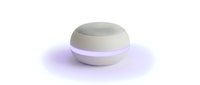 Compact spherical aromatherapy diffuser with white and lavender design, emitting soft purple mist glow, isolated on white background for product mockups and wellness marketing.