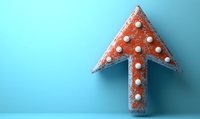 Red polka dot arrow pointing upward on blue background, textured with glitter effect. Minimalist composition with copy space for business growth concepts.