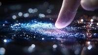 Glowing digital fingerprint scan with finger touching biometric surface amid blue light particles and bokeh effects, representing security technology.