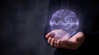 Hands holding glowing neon brain with swirling patterns against dark background, representing artificial intelligence, innovation, technology, and digital transformation for business concepts.