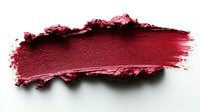 Deep burgundy lipstick smear with textured edges on white background, isolated cosmetic makeup stroke for beauty and fashion design projects.