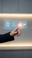 Male hand in business attire selecting glowing neon icons on transparent digital interface displaying globe, cloud computing, settings, and communication symbols for technology solutions.