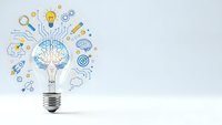 Light bulb with brain inside surrounded by innovation icons representing creative thinking and business ideas on white background.