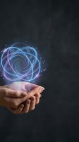 Hands holding glowing holographic sphere with digital icons and light effects on dark background for technology and innovation concepts.