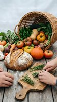 Fresh autumn harvest spilling from wicker basket with artisan bread and herbs on rustic wooden table for seasonal cooking and farm-to-table dining.