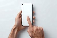 Male hands holding smartphone with blank white screen, finger touching display for app mockup and mobile interface design projects.