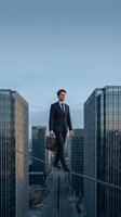Confident businessman walking on tightrope between skyscrapers holding briefcase in urban cityscape representing risk management and business challenges.