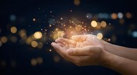 Open hands holding magical glowing particles and sparkles against dark bokeh background for spiritual wellness and energy healing concepts.
