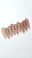 Nude eyeshadow palette swatches in earth tones from light to dark brown shades on white background for makeup and beauty applications.