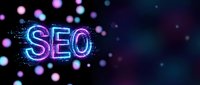 Glowing neon SEO letters with digital particles and bokeh lights on dark background for web marketing and search engine optimization concepts.