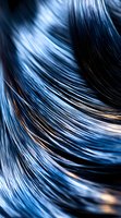 Abstract flowing lines in deep blue and white create dynamic movement against black background, suggesting water or light streams for modern design projects.