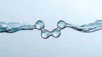 Mesmerizing water drops colliding in mid-air creating symmetrical splash formation with air bubbles against light blue background, captured in high-speed macro photography.