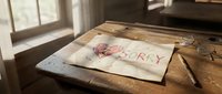 Handwritten sorry note with a drawn heart on aged paper lying on a rustic wooden desk near a sunlit window with glasses nearby.