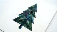 Geometric evergreen tree composed of layered triangular shapes in shades of teal, green, and navy, creating an abstract upward arrow on white background for modern design projects.