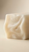 Artisan handmade white soap bar with swirling marble texture on neutral background, natural organic skincare product for beauty and wellness.