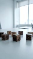 Wooden cubes with business icons on office desk representing innovation, teamwork and creative solutions for corporate strategy and brainstorming sessions.