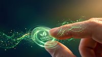 Hand touching glowing green energy efficiency button with digital particles and light effects representing sustainable technology and eco-friendly solutions.