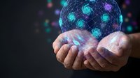 Digital network sphere floating above cupped hands with glowing connections and data visualization elements for technology and innovation concepts.