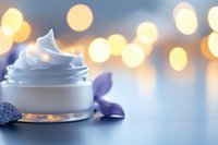 Luxury skincare cream jar with swirled white moisturizer against soft bokeh lights background for beauty and cosmetic product advertising.