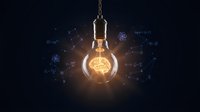 Glowing light bulb with brain filament surrounded by digital network connections and data visualization elements on dark background for innovation concepts.