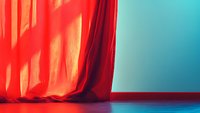 Red curtain with dramatic shadows against turquoise blue wall and floor creating minimalist theatrical stage atmosphere with strong color contrast.