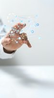 Business professional hand reaching toward glowing network connections and data points representing digital transformation and connectivity solutions.