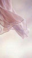 Delicate pink sheer fabric flowing gracefully against soft neutral background, creating elegant waves and folds. Suitable for fashion, beauty, and lifestyle design projects.