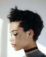 Side profile of young African American woman with short pixie haircut, freckles, and choker necklace against white background, eyes closed in serene expression.
