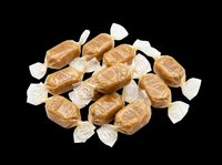 Wrapped caramel candies pile isolated on transparent background, ready for sticker, packaging, clipart, print on demand, and T-shirt design use.