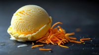 Creamy orange ice cream scoop with fresh citrus zest garnish on dark textured background, showcasing vibrant colors and smooth texture for food photography.