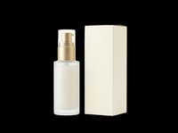 Frosted glass pump bottle with gold cap and cream box packaging, isolated on transparent background. Ready for cosmetic branding, stickers, print on demand, and T-shirt design.