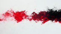 Dynamic red and black watercolor splash on white background creates dramatic horizontal streak with paint splatters and fluid abstract artistic effect.