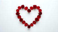 Heart shape made of red roses and petals on white background, isolated romantic symbol for Valentine's Day, wedding, and love designs.