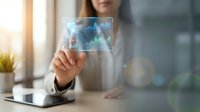Young woman with medium skin tone in business casual attire displaying holographic data analytics interface with charts and graphs for corporate technology solutions.