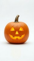Carved jack-o-lantern pumpkin with glowing face isolated on white background for Halloween decorations and seasonal design projects.