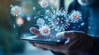 Digital representation of virus particles emerging from a tablet device held by a person, illustrating concept of digital virus spread or health information technology.