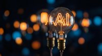 Glowing light bulb with AI letters inside filament against blurred bokeh lights background representing artificial intelligence innovation and technology concepts.