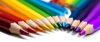 Sharpened colored pencils arranged in a rainbow spectrum on white background, suitable for art education, creative projects, design resources, and educational materials.