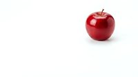 Fresh red apple isolated on white background for healthy eating and nutrition concepts.
