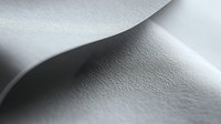 Minimalist macro photography of curved white paper or fabric surface with soft shadows creating abstract waves and gentle textural patterns. Artistic background design.