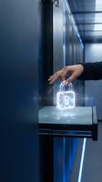 Professional hand reaching toward glowing neon padlock on digital display in modern server room environment, representing cybersecurity, data protection, and network safety concepts.